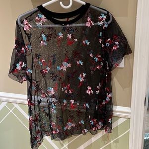Very cute floral stitched on mesh like shirt
